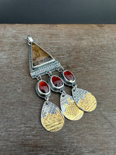 Load image into Gallery viewer, Golden rutilated quartz with garnets.