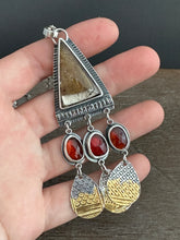 Load image into Gallery viewer, Golden rutilated quartz with garnets.