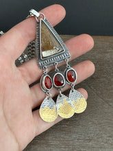 Load image into Gallery viewer, Golden rutilated quartz with garnets.