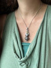 Load image into Gallery viewer, Vintage crystal dragon egg and torch medallion