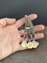 Load image into Gallery viewer, Golden rutilated quartz with garnets.