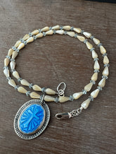 Load image into Gallery viewer, Enameled cross on a beaded mother of pearl and crystal necklace.