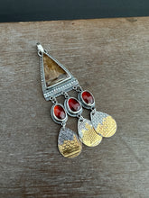 Load image into Gallery viewer, Golden rutilated quartz with garnets.