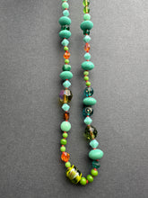 Load image into Gallery viewer, Vintage glass bead silk knotted necklace in greens and oranges
