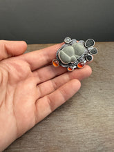 Load image into Gallery viewer, Fairy stone Pendant/Brooch with trilobites and garnets