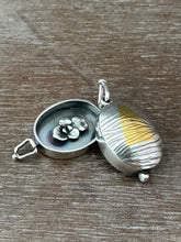 Load image into Gallery viewer, Textured oval flower locket.
