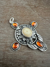 Load image into Gallery viewer, Fossilized walrus and garnets pendant.