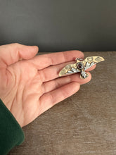 Load image into Gallery viewer, Bronze and silver stamped bird pendant with garnet