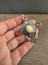 Load image into Gallery viewer, Fossilized walrus and garnets pendant.