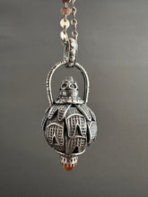 Load image into Gallery viewer, Vintage crystal and carnelian dragon egg medallion
