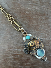 Load image into Gallery viewer, Bronze lion with aquamarine