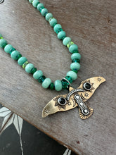 Load image into Gallery viewer, Bronze and silver stamped bird on hand knotted silk and gemstone necklace