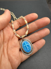 Load image into Gallery viewer, Enameled cross on a beaded mother of pearl and crystal necklace.