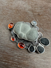 Load image into Gallery viewer, Fairy stone Pendant/Brooch with trilobites and garnets