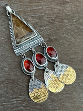 Load image into Gallery viewer, Golden rutilated quartz with garnets.