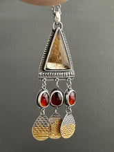 Load image into Gallery viewer, Golden rutilated quartz with garnets.