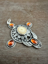 Load image into Gallery viewer, Fossilized walrus and garnets pendant.
