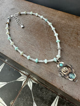 Load image into Gallery viewer, Bronze lion with aquamarine