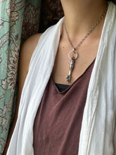 Load image into Gallery viewer, Hand pendant with a flower on the palm and gold accents