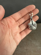 Load image into Gallery viewer, Hands holding a Peruvian Opal