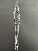 Load image into Gallery viewer, Hand pendant with a flower on the palm and gold accents