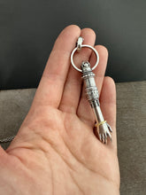 Load image into Gallery viewer, Hand pendant with a flower on the palm and gold accents