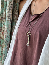 Load image into Gallery viewer, Hand pendant with a flower on the palm and gold accents