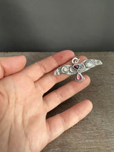 Load image into Gallery viewer, Large stamped bird pendant with a Winza Sapphire and garnet.