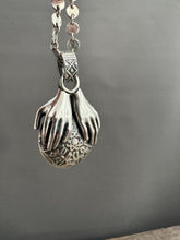 Load image into Gallery viewer, Hands holding a Peruvian Opal