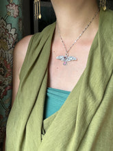 Load image into Gallery viewer, Large stamped bird pendant with a Winza Sapphire and garnet.