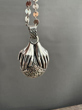 Load image into Gallery viewer, Hands holding a Peruvian Opal