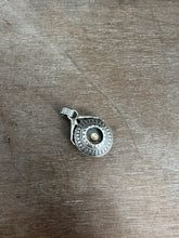 Load image into Gallery viewer, Hands holding a moissanite set in 22k gold