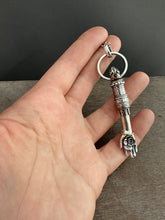 Load image into Gallery viewer, Hand pendant with a flower on the palm and gold accents