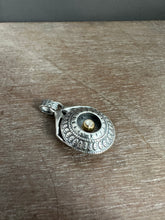 Load image into Gallery viewer, Hands holding a moissanite set in 22k gold