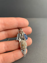 Load image into Gallery viewer, Fossilized sand dollar and kyanite charm necklace
