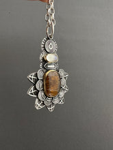 Load image into Gallery viewer, Cacoxenite and moonstone set in 22k gold medallion