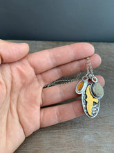 Load image into Gallery viewer, Garnet and beach stone with a gold hawk charm collection