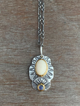 Load image into Gallery viewer, Fossilized mastodon ivory and tanzanite set in 22k gold charm necklace