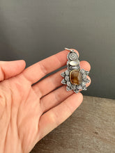 Load image into Gallery viewer, Cacoxenite and moonstone set in 22k gold medallion