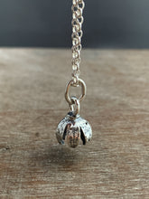 Load image into Gallery viewer, Cast seed pod charm