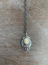 Load image into Gallery viewer, Fossilized mastodon ivory and tanzanite set in 22k gold charm necklace