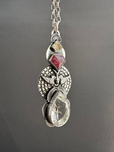 Rutilated quartz bird medallion