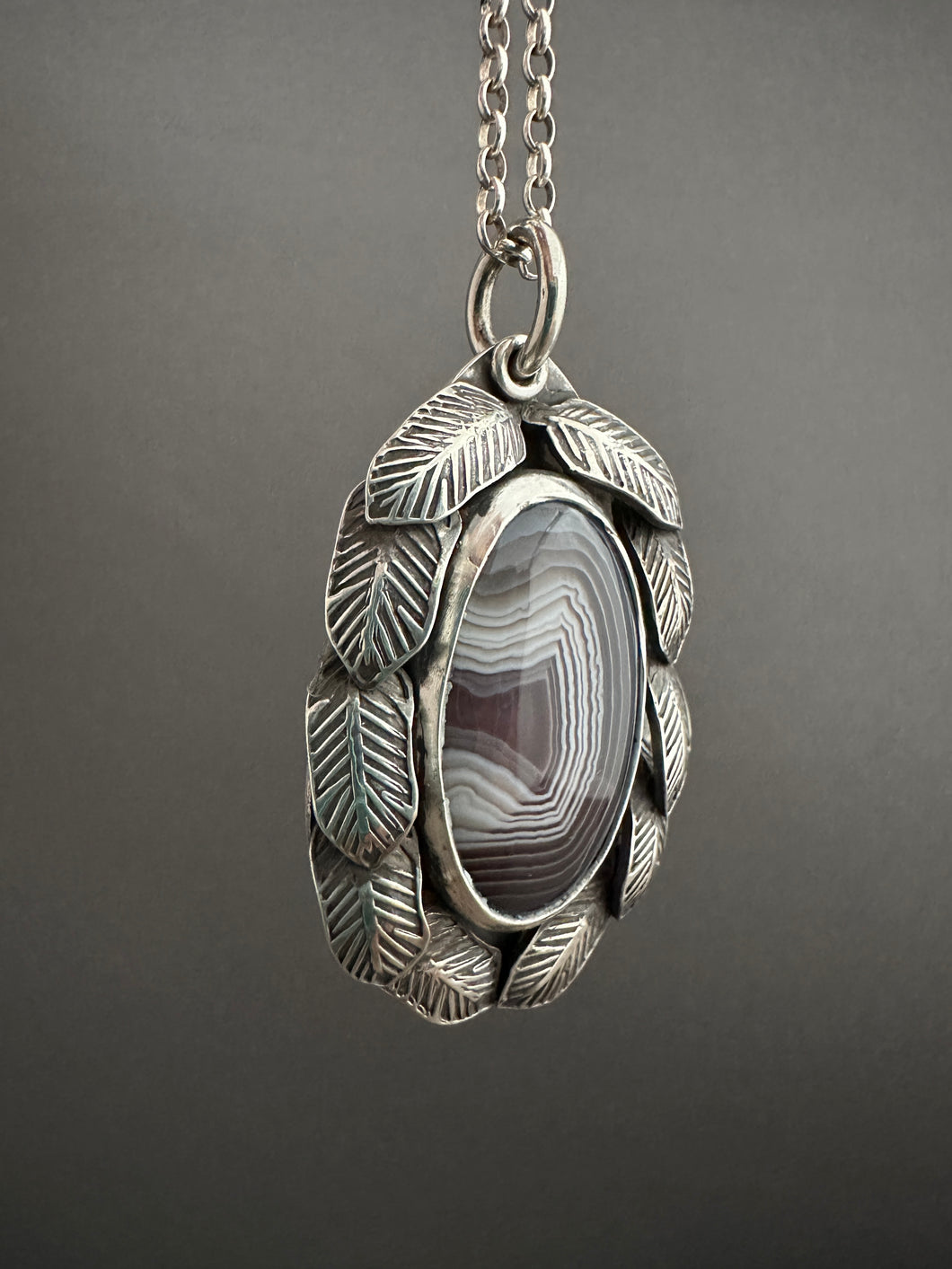 Botswana agate and feathers pendant
