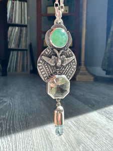 Green amethyst bird medallion