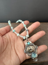 Load image into Gallery viewer, Bronze lion with aquamarine
