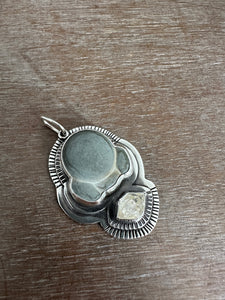 Fairy stone and quartz crystal pendant