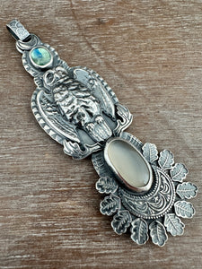 Helen the owl and a moonstone