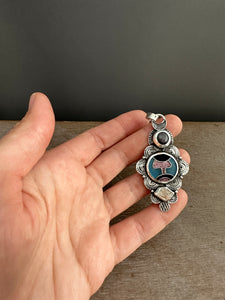 Cloisonné glass enamel pendant with ruby and quartz