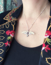 Load image into Gallery viewer, Bronze and silver stamped bird pendant with garnet
