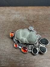 Load image into Gallery viewer, Fairy stone Pendant/Brooch with trilobites and garnets
